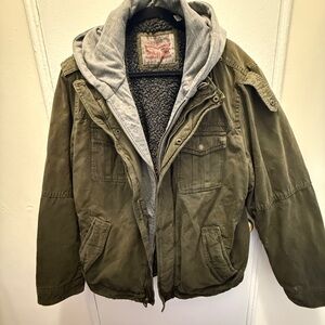 Vintage Levi's green trucker jacket with grey hood and fleece lining